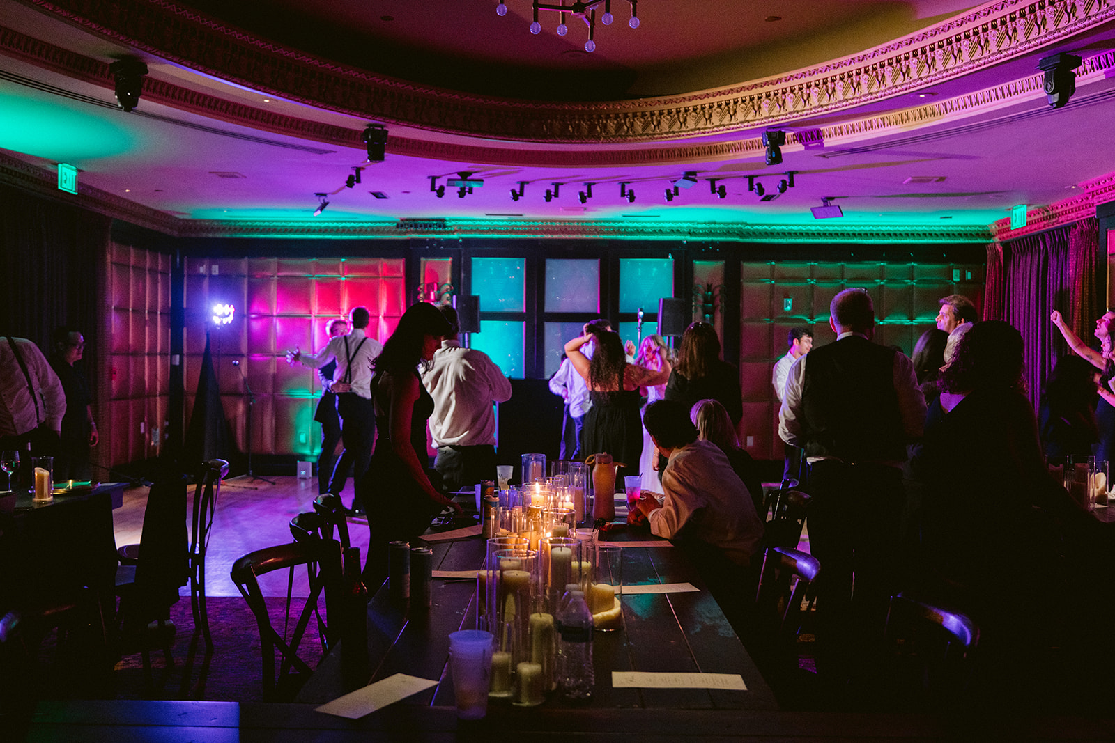 Guests dancing beneath colorful light in The Stirling Club