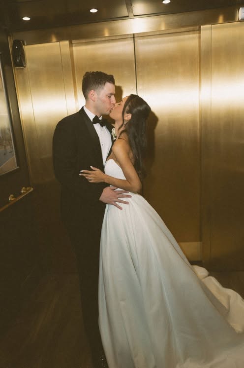 A couple sharing a kiss at The Stirling Club