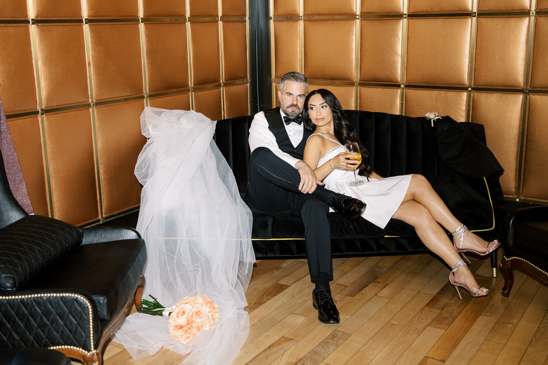 Newlyweds seated together in the Spirits Lounge at The Stirling Club